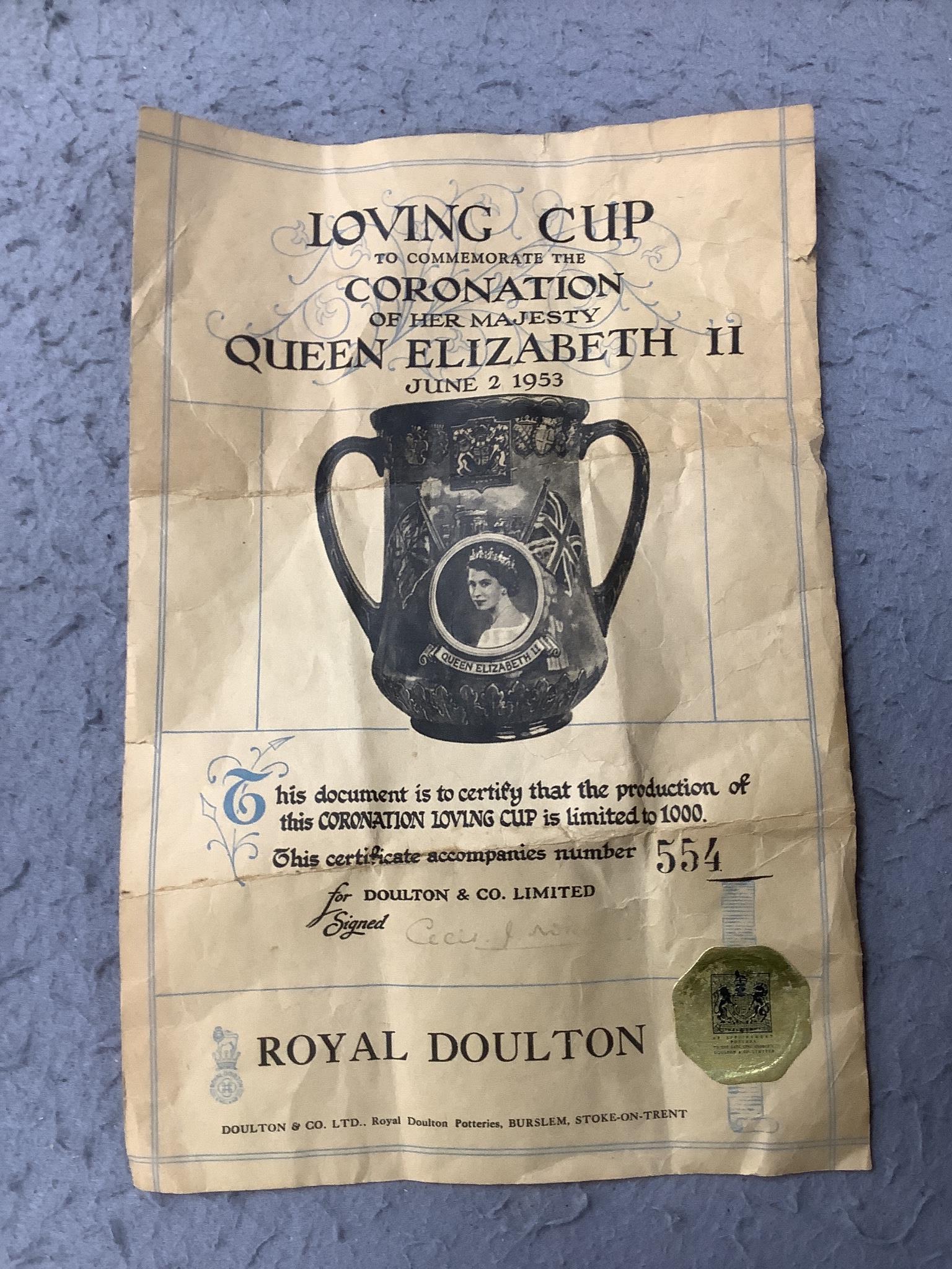 A Royal Doulton loving cup, Elizabeth II Coronation June 1953, 554 of 1000 with certificate signed by Art Director, Cecil J Noke, 27cms high